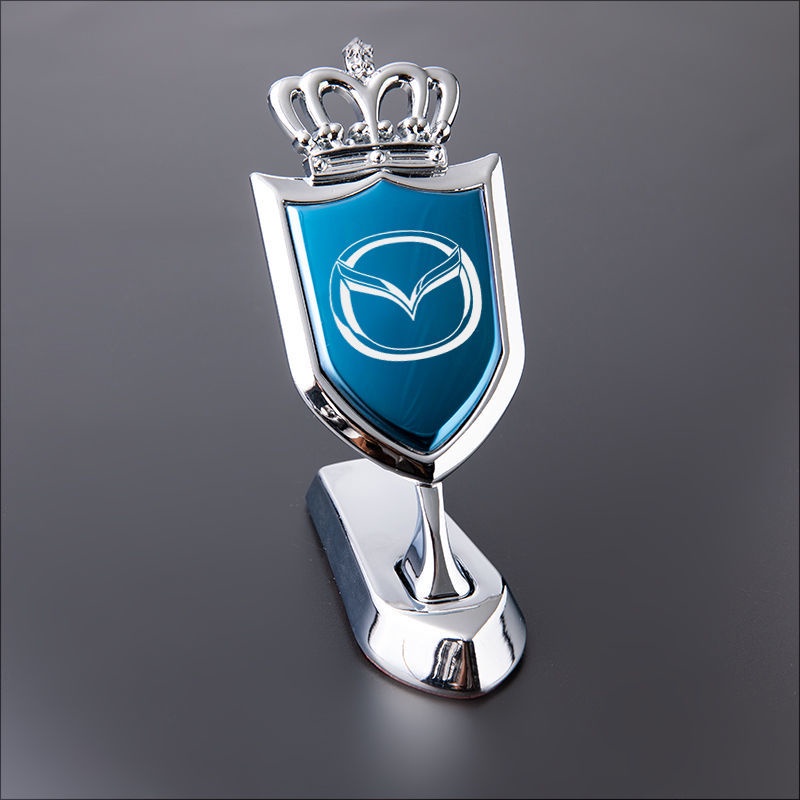 Vương miện nắp ca bô Mazda 626